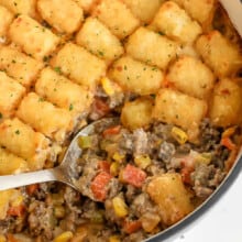 taking a spoonful of Classic Tater Tot-Casserole