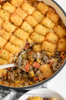 taking a spoonful of Classic Tater Tot-Casserole