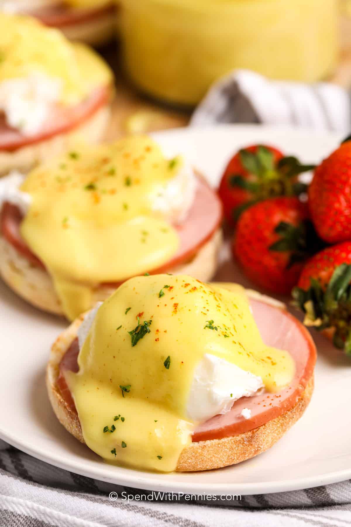 plated Eggs Benedict with strawberries