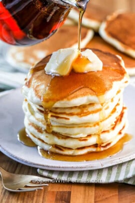 pouring syrup over Fluffy Pancakes