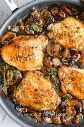 Braised Mushroom Chicken Thighs over the top view in a frying pan