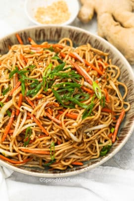 Chow Mein in a bowl with green onions as garnish