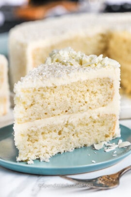 plated Coconut Cake with cake in the back