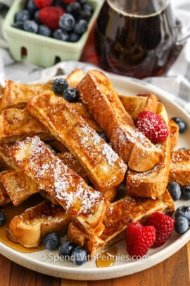 plated French Toast Sticks with icing sugar on top