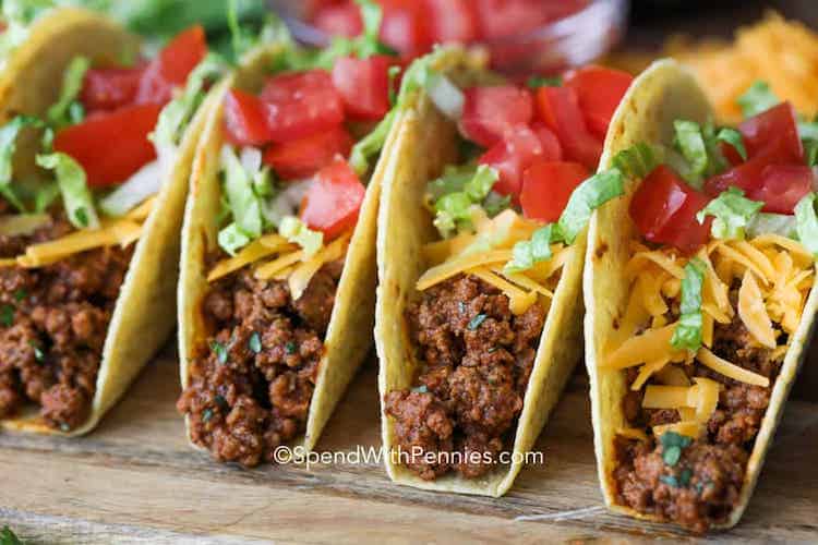 Ground beef tacos on a wooden board