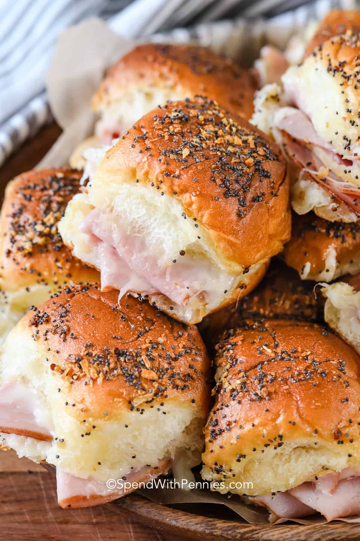 A plate of baked ham and cheese sliders