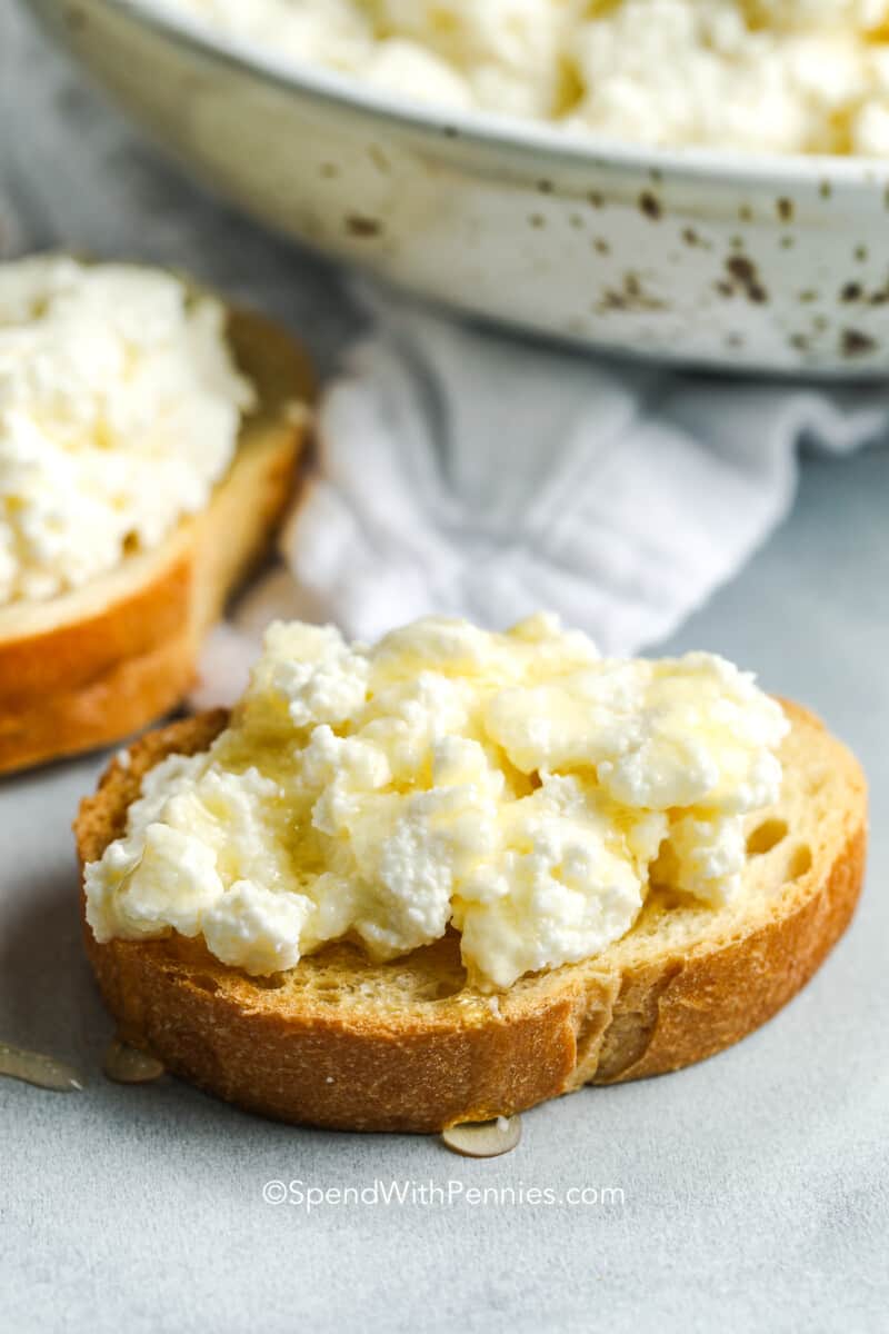 Homemade ricotta cheese on a piece of bread