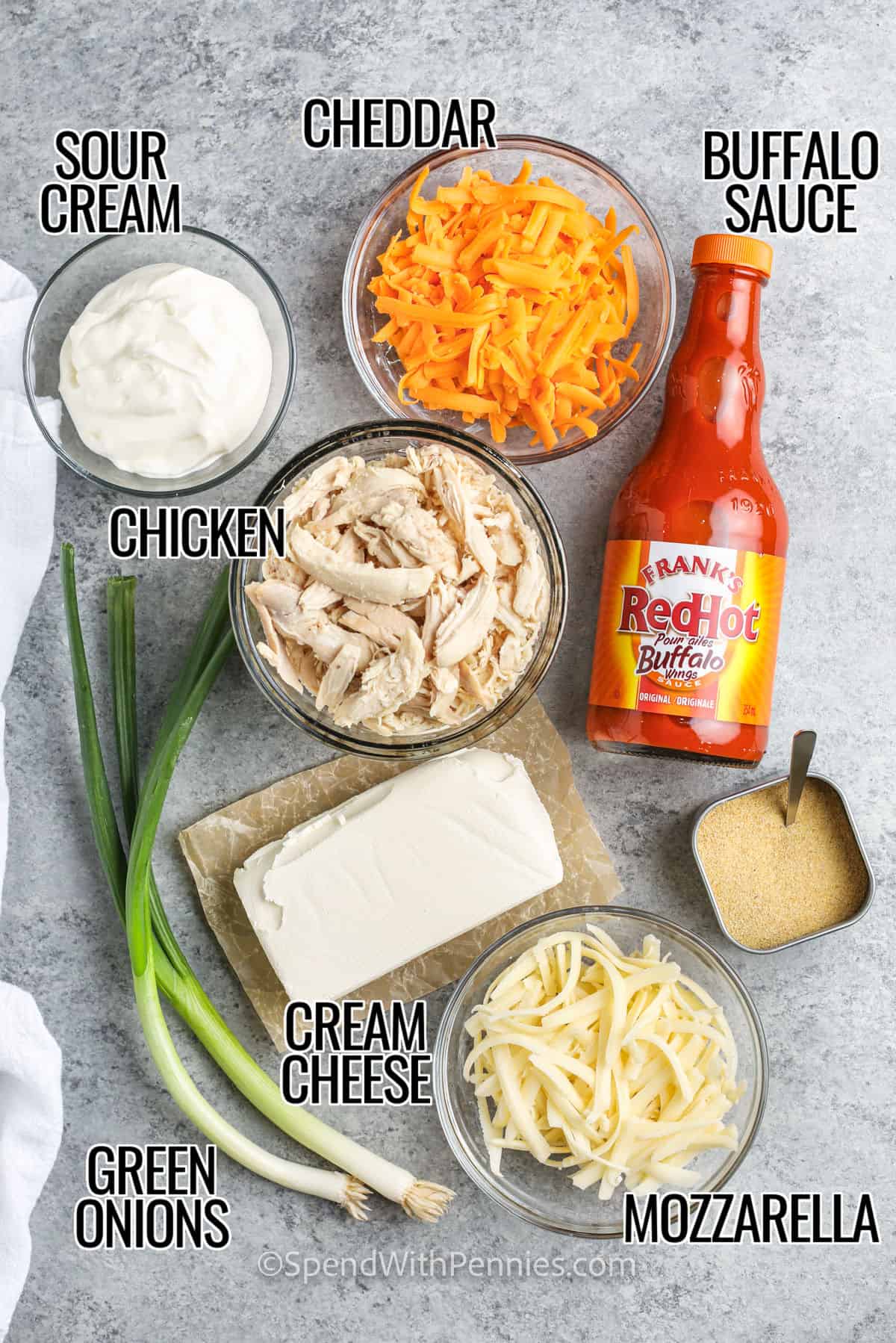 sour cream , cheddar , chicken , mozzarella , cream cheese , buffalo sauce and green onions with labels to make The Best Buffalo Chicken Dip