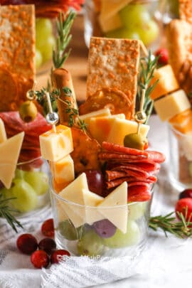 a charcuterie cup filled with meats, cheese and crackers