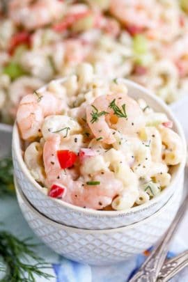 two small stacked bowls with Shrimp Pasta Salad