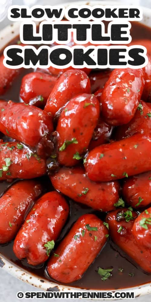 close up of Slow Cooker Little Smokies in a bowl with writing