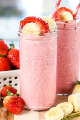 Strawberry Banana Smoothies in jars with fruit