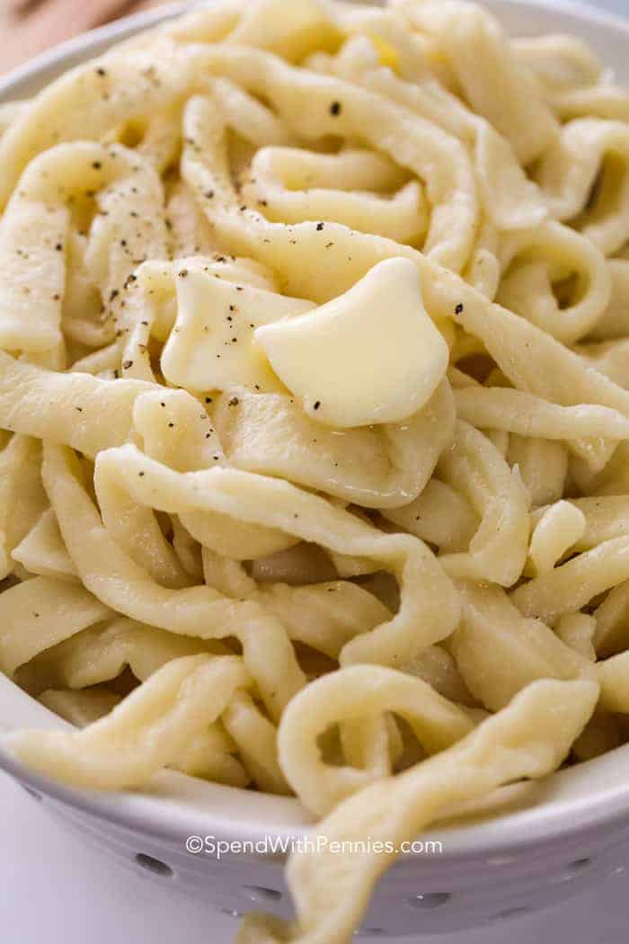 Closeup of butter melting on Homemade Egg Noodles