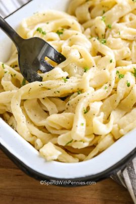 Fork in dish full of Homemade Egg Noodles