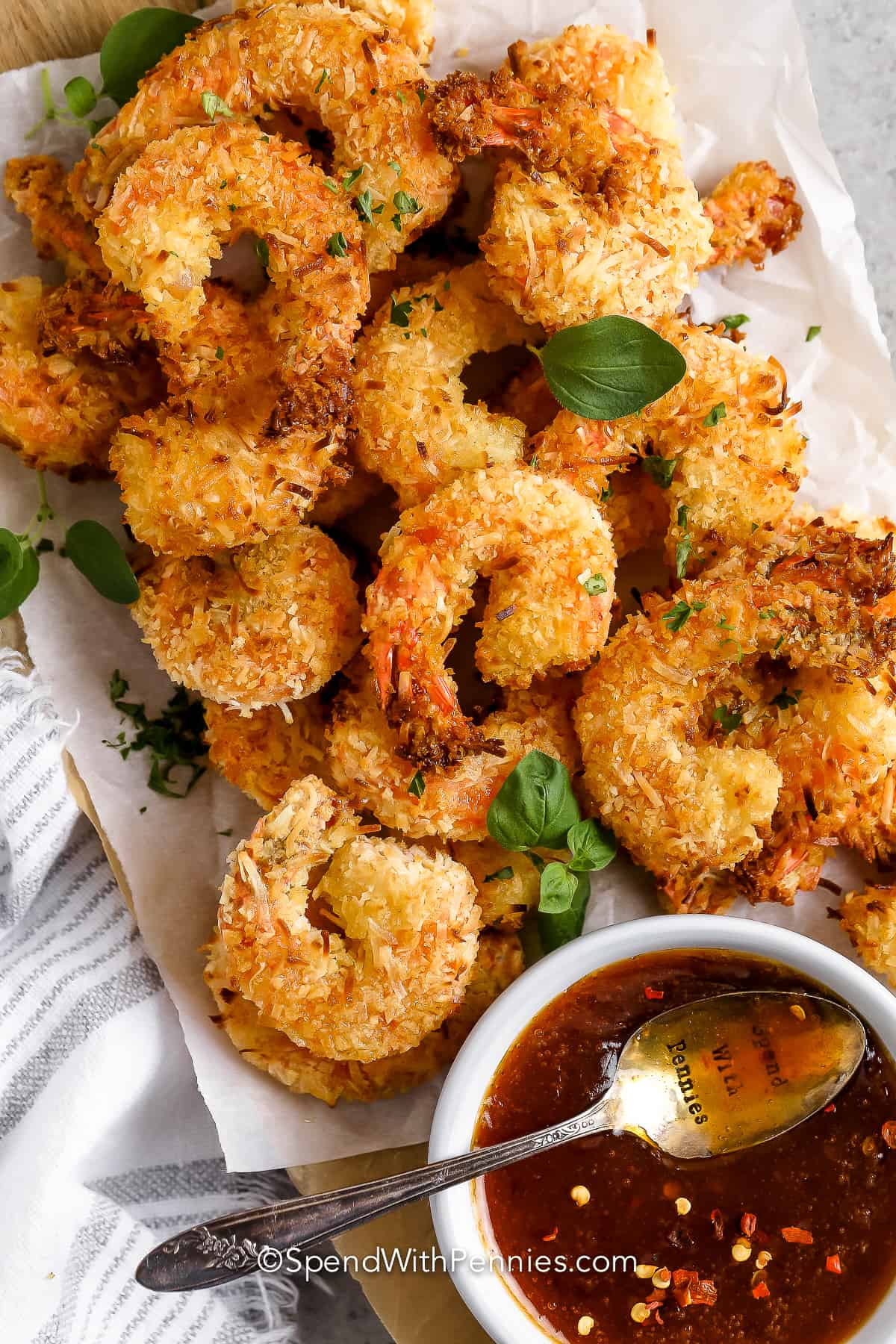 a plate of coconut shrimp with sweet chili sauce