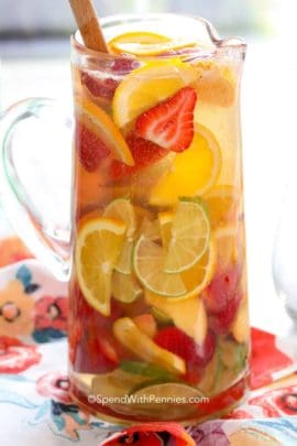 White Sangria with strawberries, limes and oranges